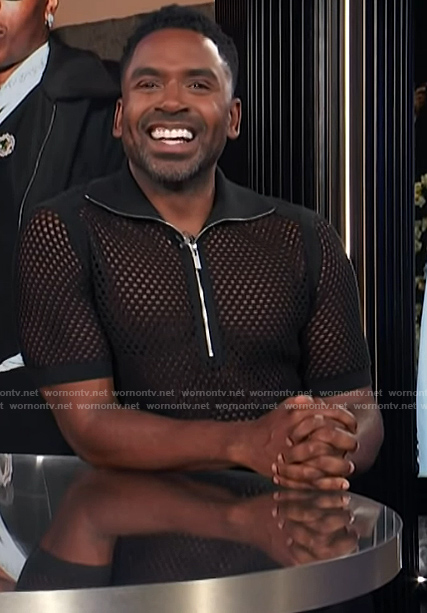 Justin’s black mesh half zip polo on E! News