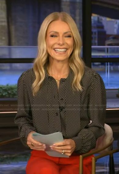 Kelly’s black polka dot print tie neck top on Live with Kelly and Mark