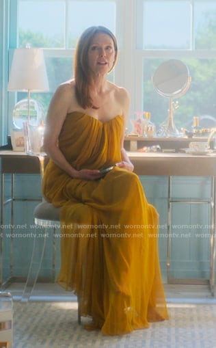 Kiki’s yellow draped strapless gown on Sirens