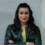 Lois’s metallic colorblock knit top and leather jacket on General Hospital