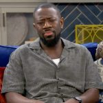 Malcolm’s khaki green triangle shirt on The Neighborhood