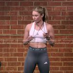 Mikaela Shiffrin’s white sports bra and leggings on The Voice