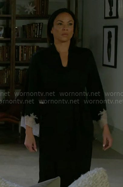 Nicole’s black robe with white lace trims on Beyond the Gates