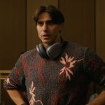 Tobias’s gray floral sweater on Etoile
