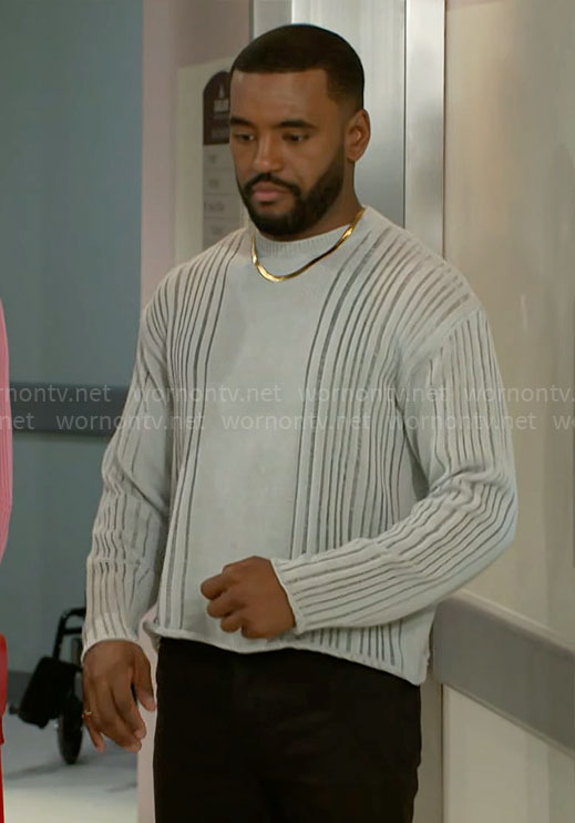 Andre’s grey laddered sweater on Beyond the Gates