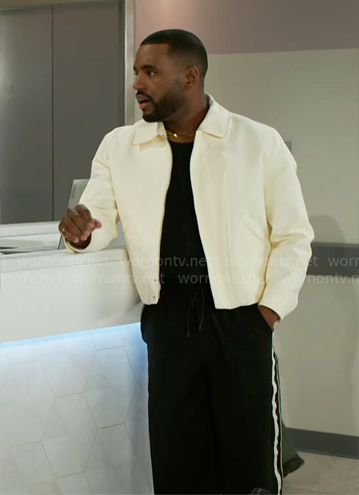 Andre’s off white jacket and side-stripe pants on Beyond the Gates