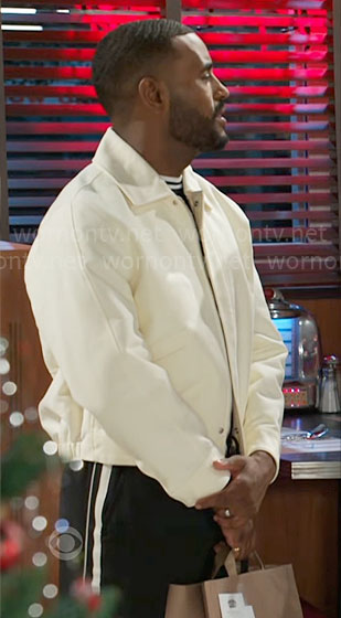 Andre’s off white jacket and side-stripe pants on Beyond the Gates