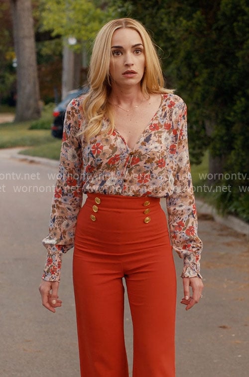 Georgia’s floral blouse and orange pants on Ginny & Georgia