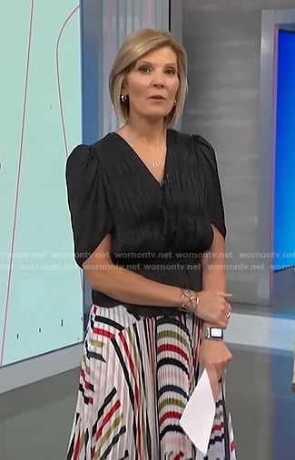 Kate’s black gathered top and pleated skirt on NBC News Daily