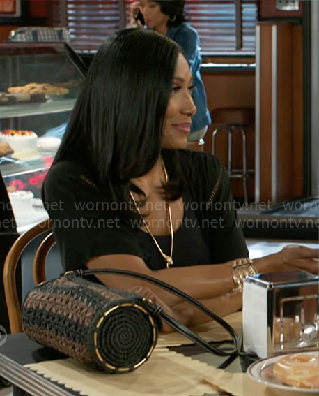 Leslie’s brown and black striped bag on Beyond the Gates