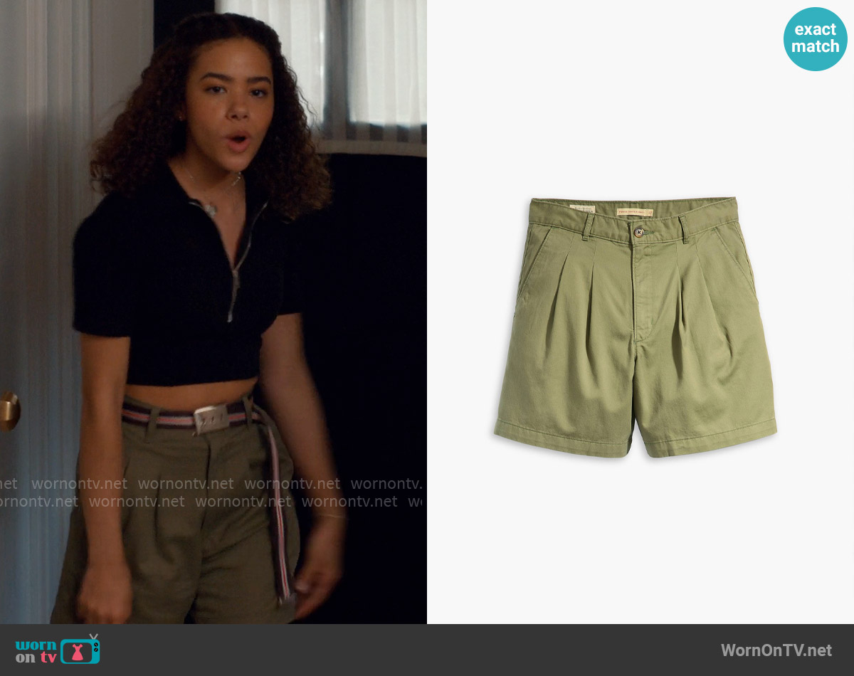 WornOnTV: Ginny's black zip polo top and green pleated shorts on