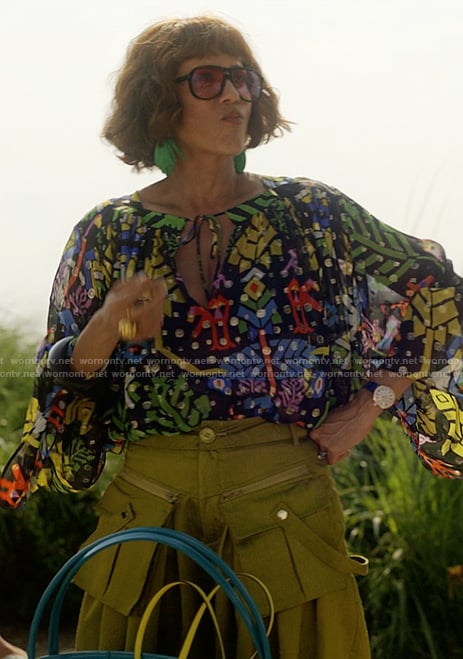 Lisa’s black floral print keyhole blouse and pants on And Just Like That
