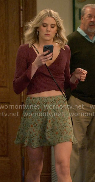 Josie’s green floral skirt and burgundy top on Leanne