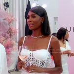 Kiki’s white eyelet belted dress on The Real Housewives of Miami