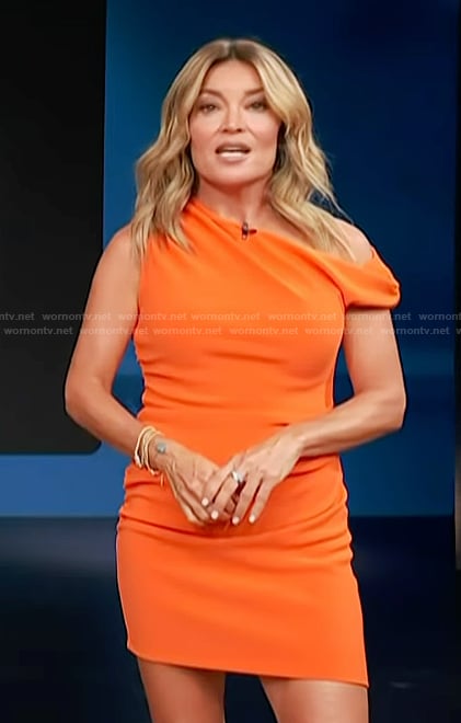 Kit’s orange one shoulder mini dress on Access Hollywood