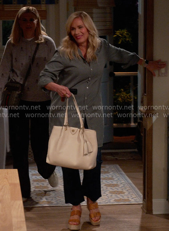 Leanne’s green long shirt and white bag with tassels on Leanne