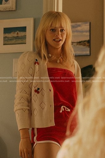 Mirren’s red strapless romper and white pointelle cherry cardigan on We Were Liars