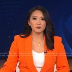 Nancy Chen’s orange blazer and pants on CBS Evening News