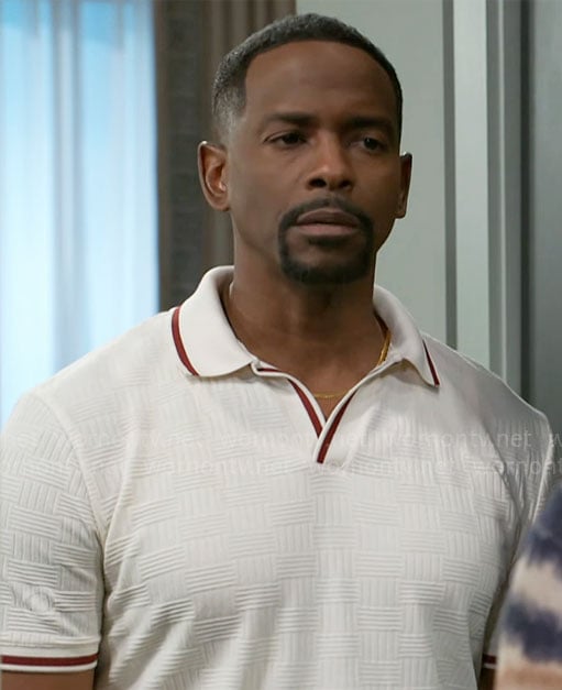 Ted’s white textured polo shirt with red trims on Beyond the Gates