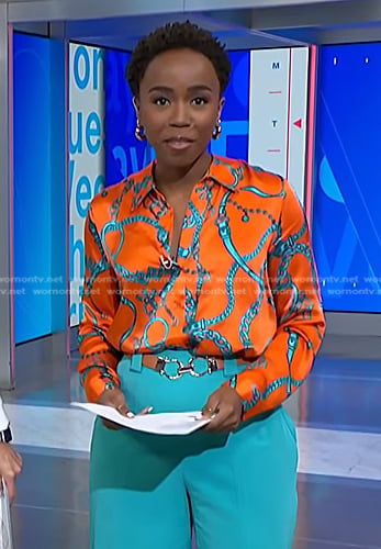 Zinhle’s orange chain print blouse and teal blue pants on NBC News Daily