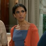 Dani’s blue top and orange cardigan on Beyond the Gates