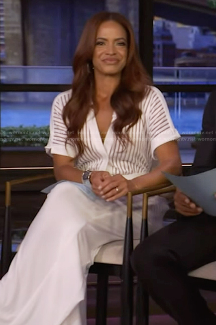 Elle Duncan’s white sheer stripe jumpsuit on Live with Kelly and Mark