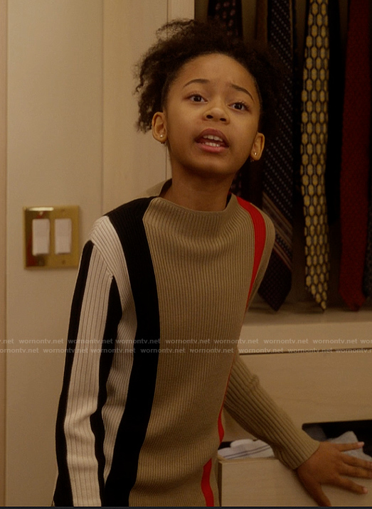 Gabrielle’s plaid sweater and mini skirt on And Just Like That