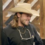 Jesse’s black henley shirt on The McBee Dynasty Real American Cowboys