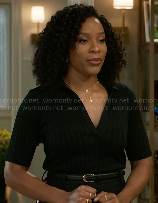 Naomi’s black rib knit polo top and side-stripe pants on Beyond the Gates