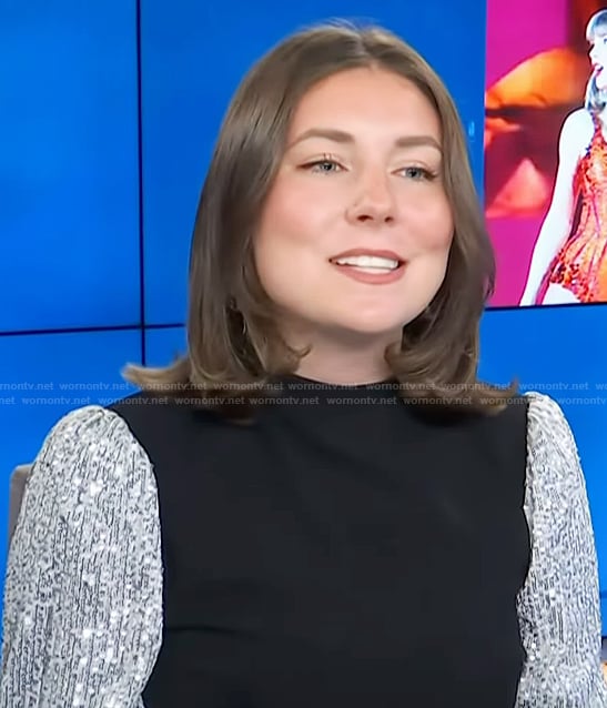 Reagan’s black sequin sleeve sweater on Access Hollywood