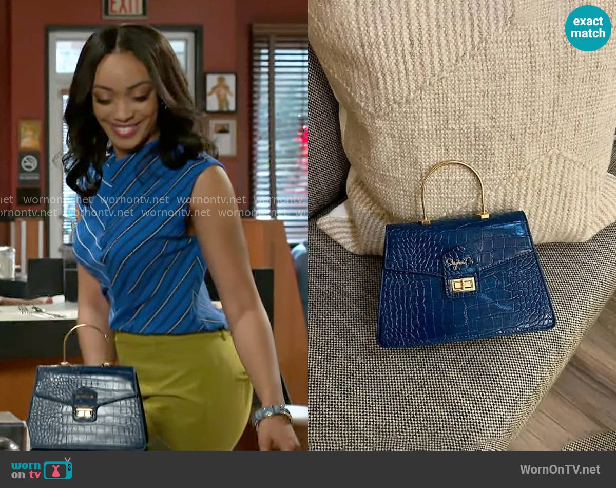Shydiva Tracee Bag worn by Madison Montgomery (Kenjah) on Beyond the Gates
