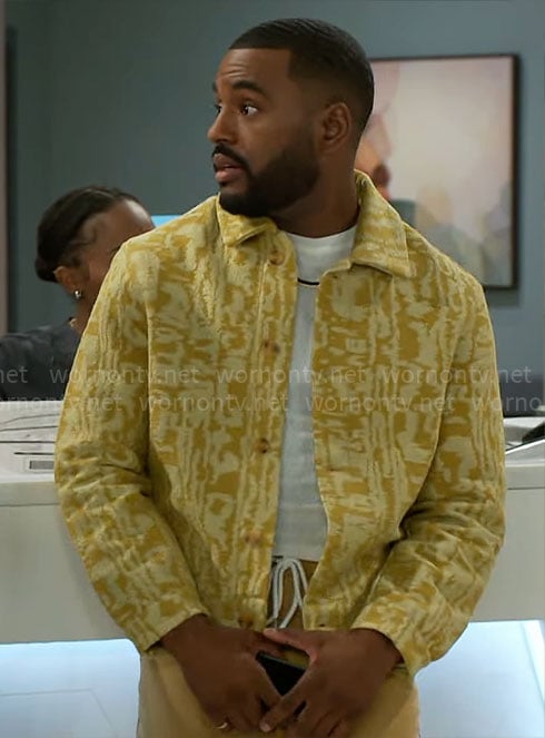 Andre’s yellow patterned jacket on Beyond the Gates