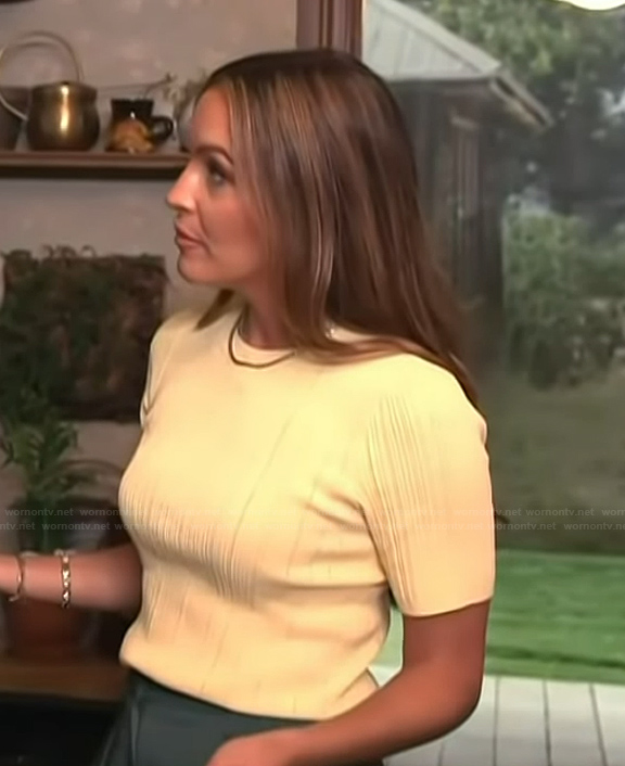 Emily’s yellow short sleeve top on Access Hollywood