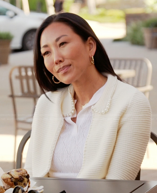 Katie’s white pearl trim cardigan on The Real Housewives of Orange County