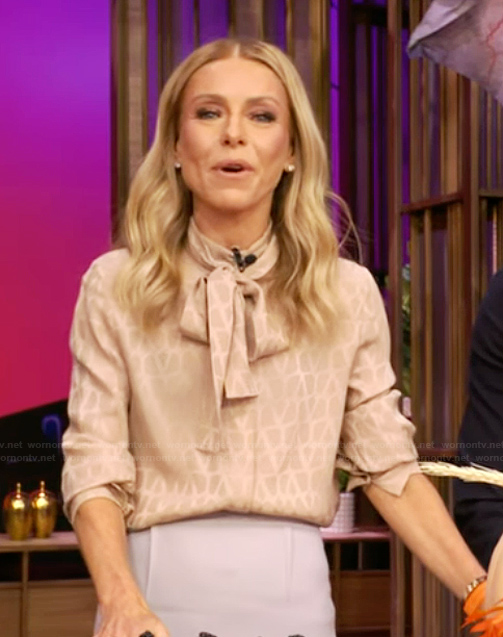 Kelly’s beige tie neck blouse on Live with Kelly and Mark