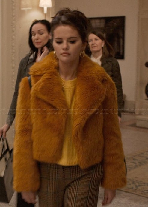Mabel’s orange fur jacket and plaid pants on Only Murders in the Building