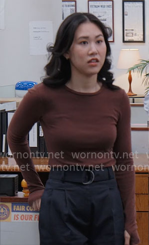 Nicole’s brown top and navy belted pants on The Paper