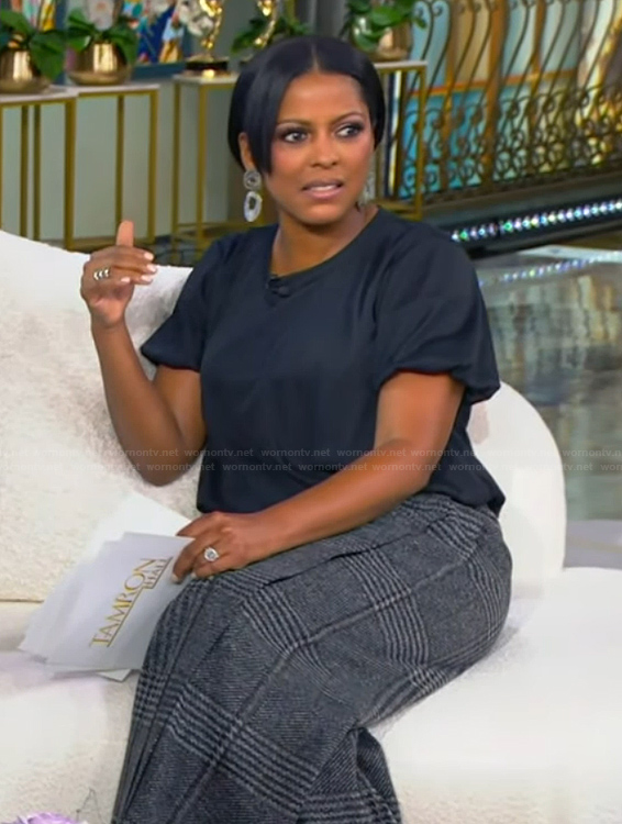 Tamron’s black top and plaid pants on Tamron Hall Show