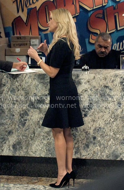 Bradley’s black flared hem dress on The Morning Show