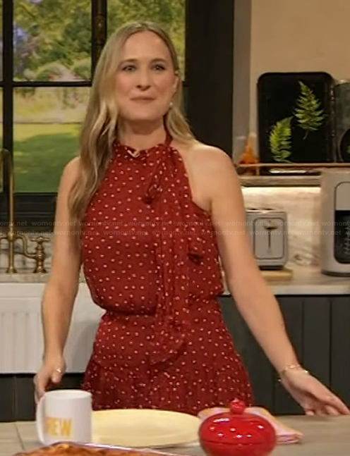 Courtney McBroom’s red polka dot tie neck dress on The Drew Barrymore Show