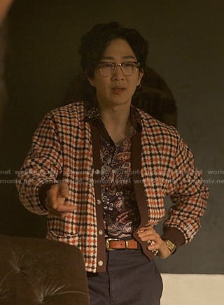 Daniel’s orange check cardigan on Reasonable Doubt