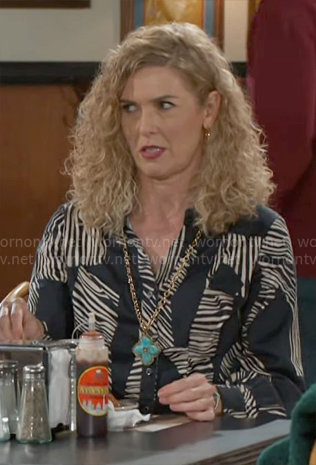 Jan’s blue zebra print shirt on Beyond the Gates