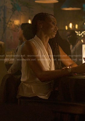 Jax’s white sleeveless wrap top on Reasonable Doubt