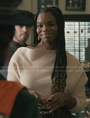 Julia’s ivory ribbed off-shoulder sweater on Elsbeth