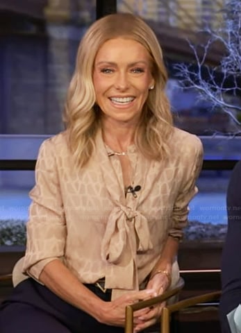 Kelly’s beige tie neck blouse on Live with Kelly and Mark