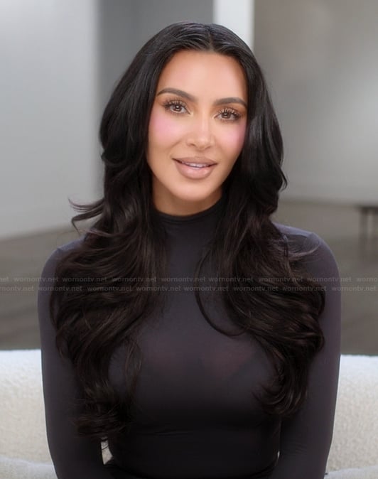 Kim’s black mock neck confessional top on The Kardashians
