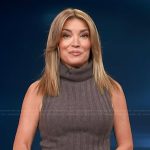 Kit’s brown turtleneck ribbed tank and leather skirt on Access Hollywood