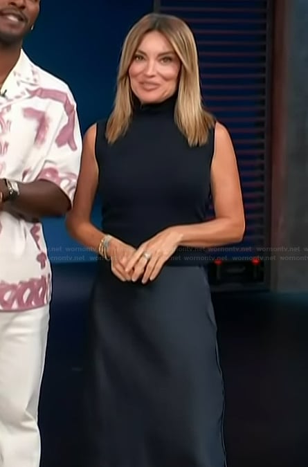 Kit’s navy vest and satin skirt on Access Hollywood