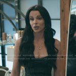 Raquel’s blac kleather corset mini dress on Elsbeth