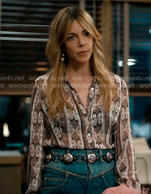 Morgan’s printed shirt and denim mini skirt with gold heart earrings on High Potential